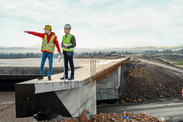 istock Engineer and investor on a road construction site 1503887259