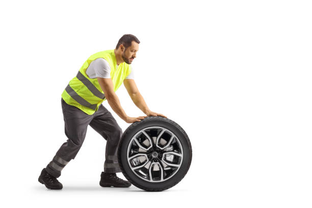 istock Road assistance mechanic pushing a vehicle tire 1503888862