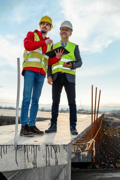 istock Engineer and investor on a road construction site 1503895535