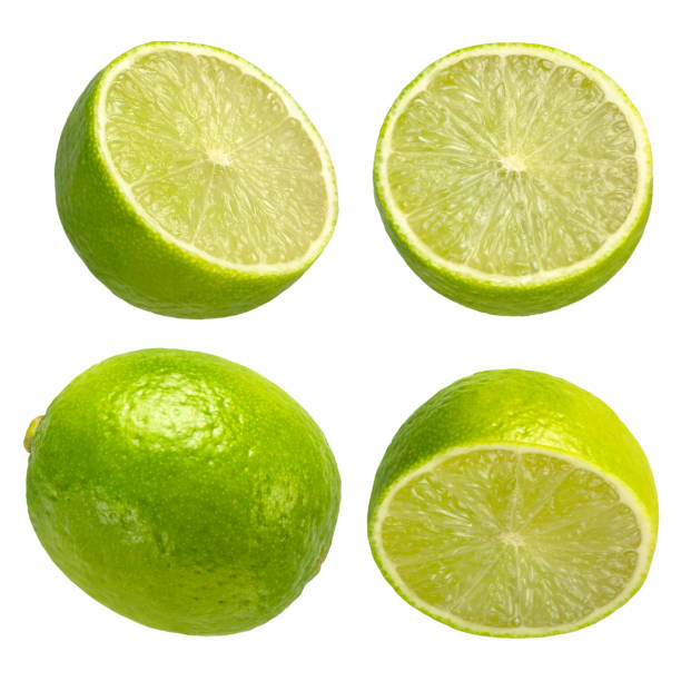 istock Lime on a white isolated background. Lime halves of different sizes from different sides close-up. Suitable for advertising banner. 1503896075