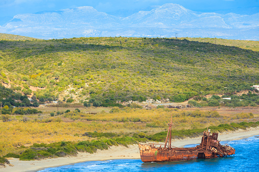 Greek coastline with the famous rusty shipwreck Dimitrios in Glyfada beach near Gytheio, Gythio Laconia Peloponnese Greece. View from distance.