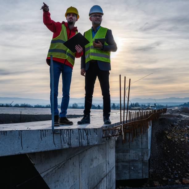 istock Engineer and investor on a road construction site 1503899602