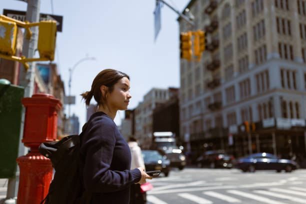 istock Asian Female Student Navigating Soho and West Village with Mobile Phone 1503900295