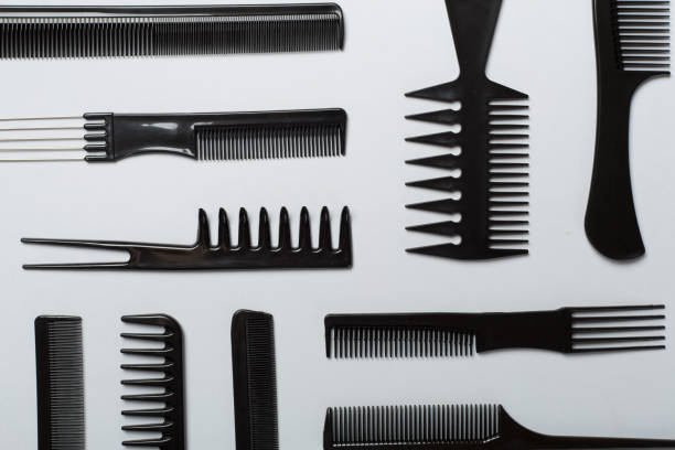 istock Professional combs and hairdresser tools on color background, top view 1503900578