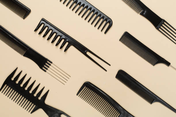 istock Professional combs and hairdresser tools on color background, top view 1503900579