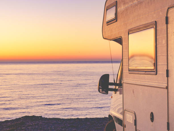 istock Rv camper camping on sea shore, Spain. 1503900905