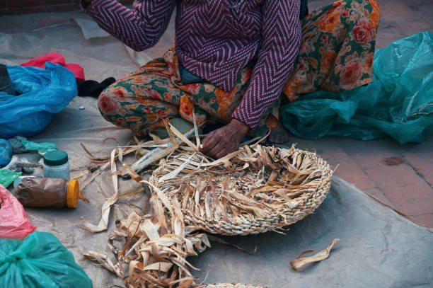 istock Midsection of woman weaving wicker basket 1503920606