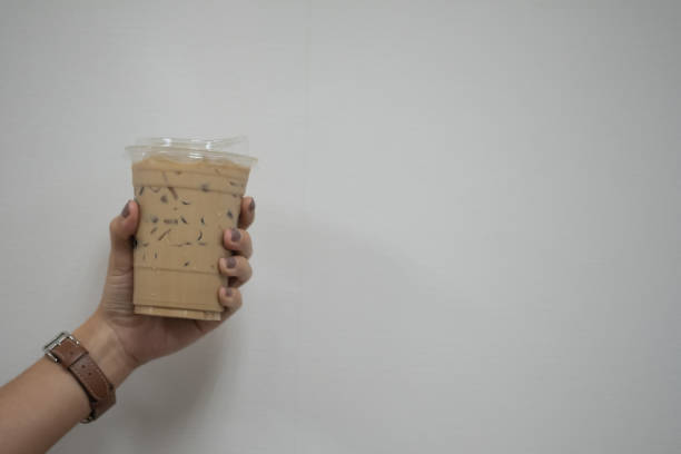 istock Woman holding takeaway plastic cup with cold coffee drink 1503921026