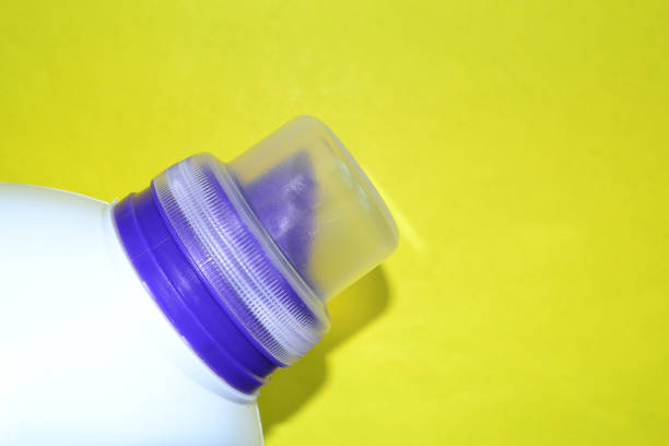 istock a bottle with powder lies on a yellow background 1503930550