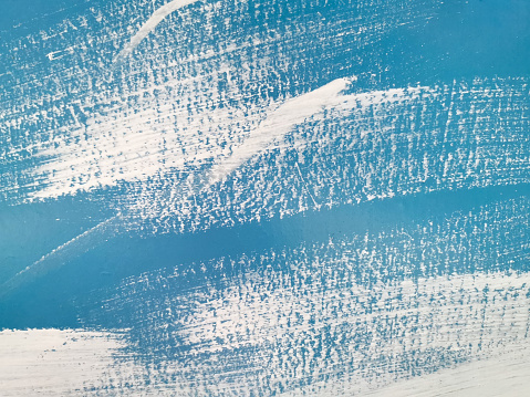 White paint strokes on blue wall