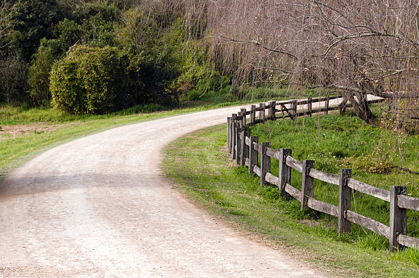 istock Country lane with post and rail fence 150395266