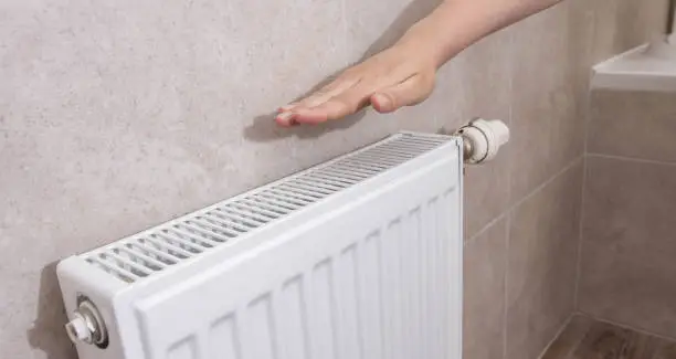 Wall radiator in the room. Increasing the price of water heating. Comfortable temperature in the house, industry. Dry air. Copy space for text