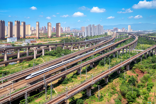 High-speed train crosses railway transportation hub