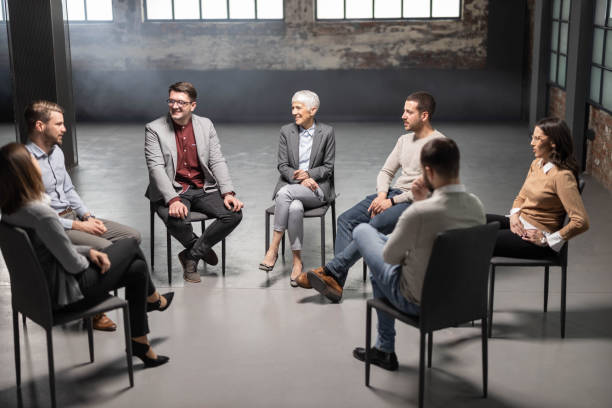 istock Happy business colleagues talking on a group therapy. 1503981657