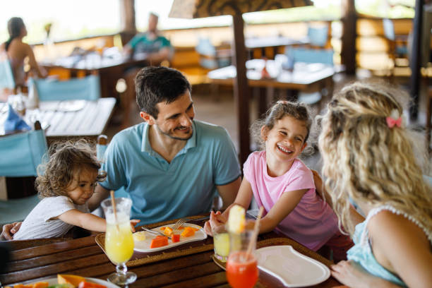 istock Happy family having lunch at restaurant's terrace. 1503991296