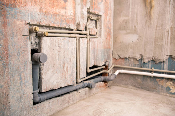 istock Supply of polypropylene water pipes in the wall and sewerage drain. Copy space for text 1503994338