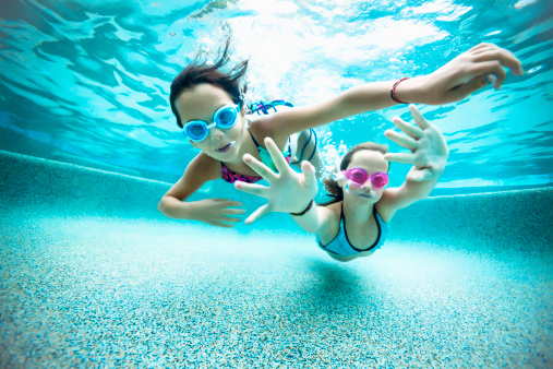 Two young girls underwater 