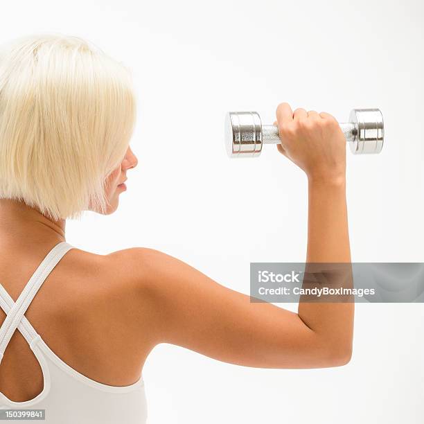 Muscular White Fitness Woman Hold Weights Stock Photo - Download Image Now - Activity, Adult, Adults Only
