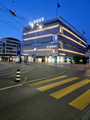 Globus is a Swiss department store company, with 13 department stores in Switzerland (Founded 1907). The Globus shopping building in Zurich City captured during summer season.