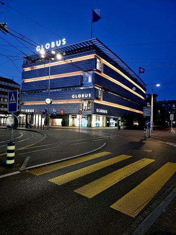 Globus is a Swiss department store company, with 13 department stores in Switzerland (Founded 1907). The Globus shopping building in Zurich City captured during summer season.