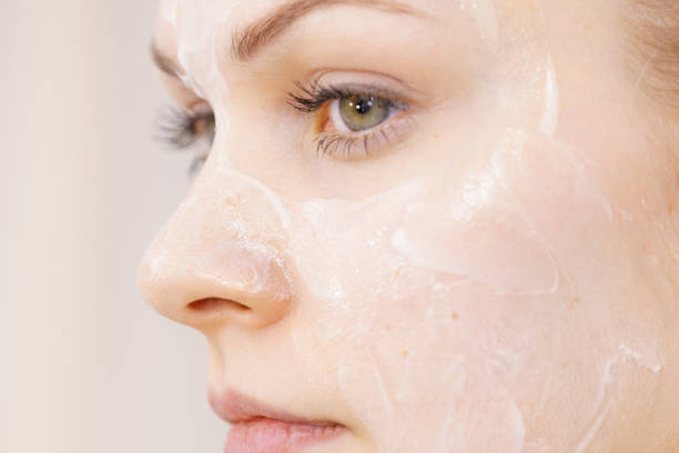 istock Girl with cream moisture cosmetic on face 1504014793