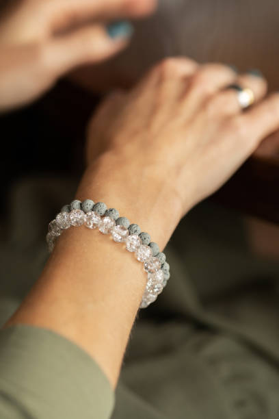 istock Woman's hand showing off her stacked style bracelet set. 1504022730