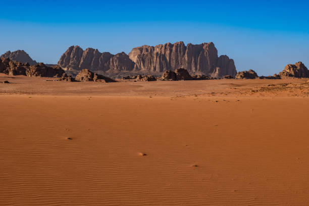 istock Wadi Rum desert in Jordan on a sunny day, rock formations and patterns on the sand 1504023666