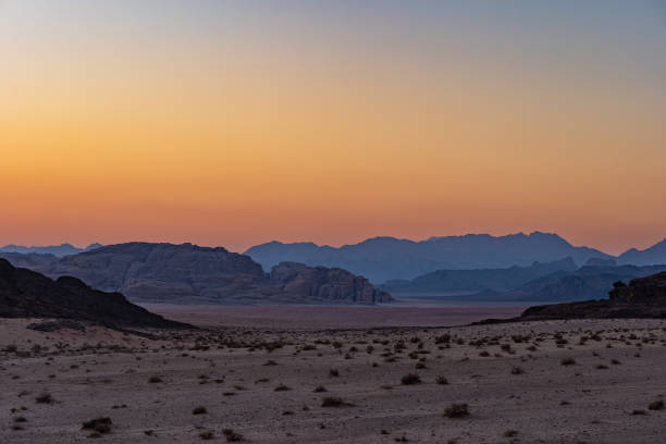 istock Wadi Rum desert in Jordan ,sunset, rock formations and patterns on the sand 1504023792
