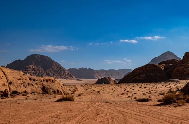 istock Wadi Rum desert in Jordan on a sunny day, rock formations and patterns on the sand 1504023883