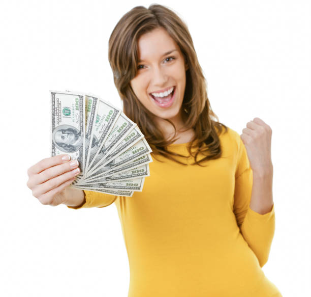 istock Young woman holding US dollars 1504025091