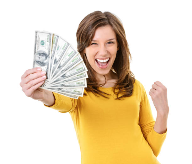 istock Young woman holding US dollars 1504025638