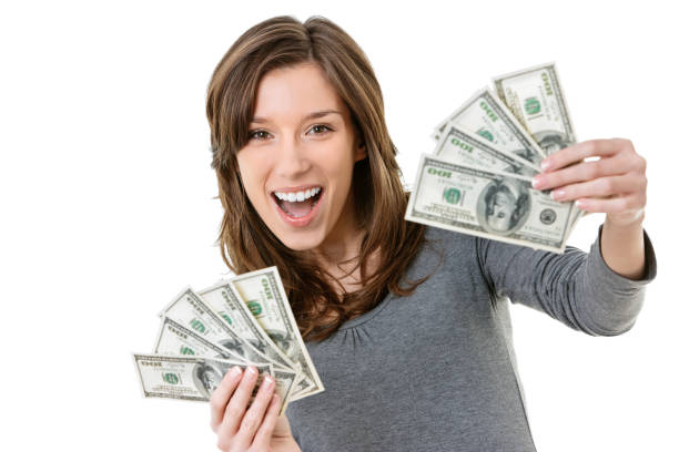 istock Young woman holding US dollars 1504025648