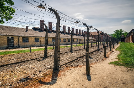 Oswiecim, Poland - May 12, 2016: Barbed wire surrounding concentration camp Auschwitz-Birkenau in Oswiecim, Poland.