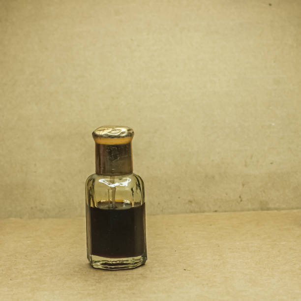 istock Black Arabic perfume in wooden background. 1504040664