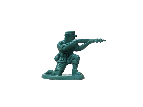Close up of child toy, kids toy, small plastic toy, plastic toy man, plastic toy soldier isolated on white background.