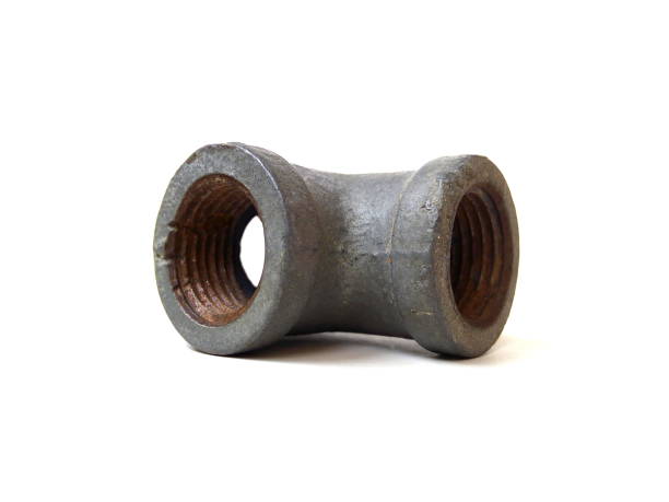 istock Close up of rusty metal pipe fitting isolated on white background. 1504058716