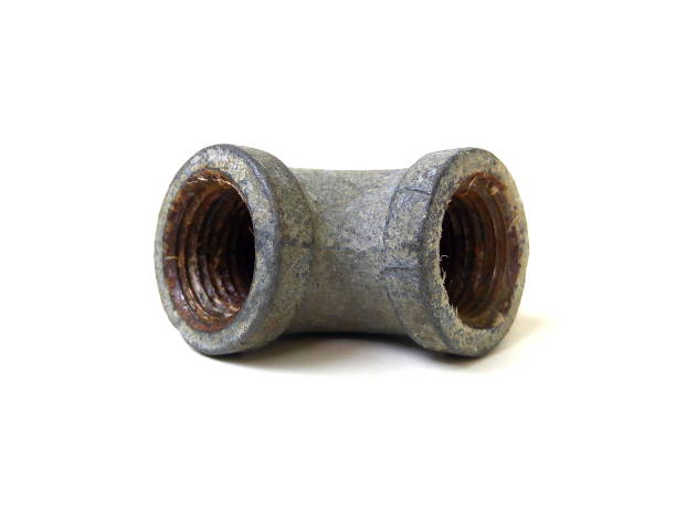 istock Close up of rusty metal pipe fitting isolated on white background. 1504058717