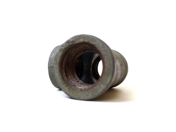 istock Close up of rusty metal pipe fitting isolated on white background. 1504058720