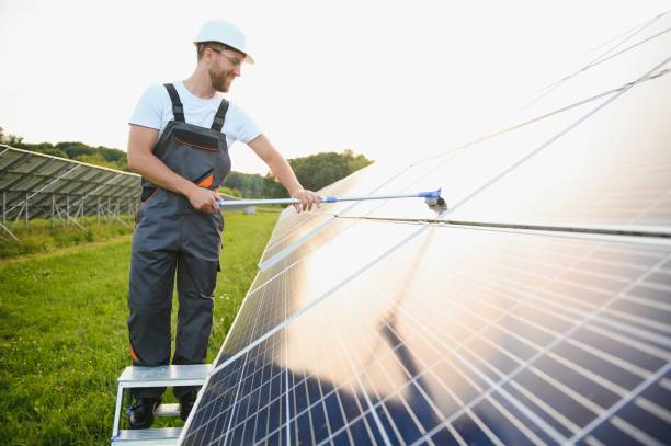 istock A handyman cleaning solar panels form dust and dirt. 1504064137