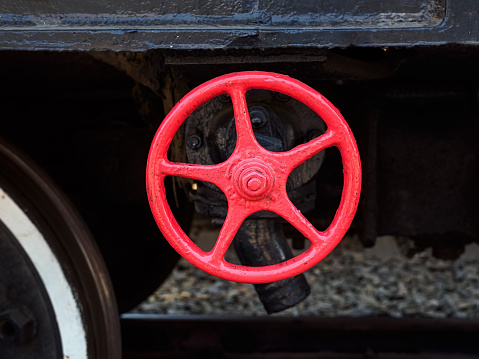 red valve on an old train close-up