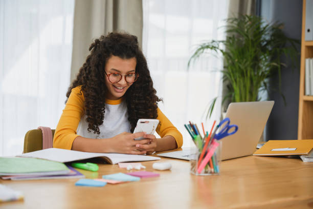 istock Happy student on her phone 1504089420