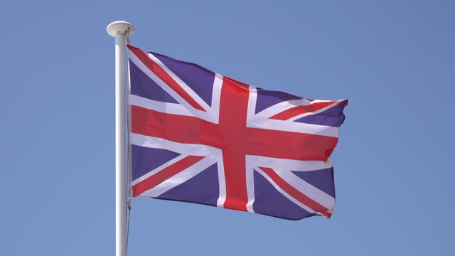 British flag waving in the wind on a flagpole
