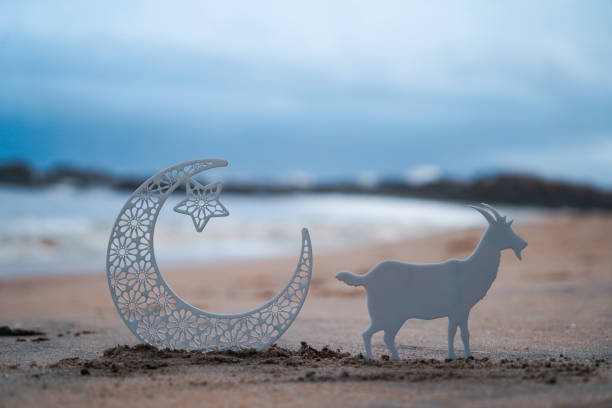 istock Eid Mubarak concept photo crescent moon with goat on the beach 1504098867