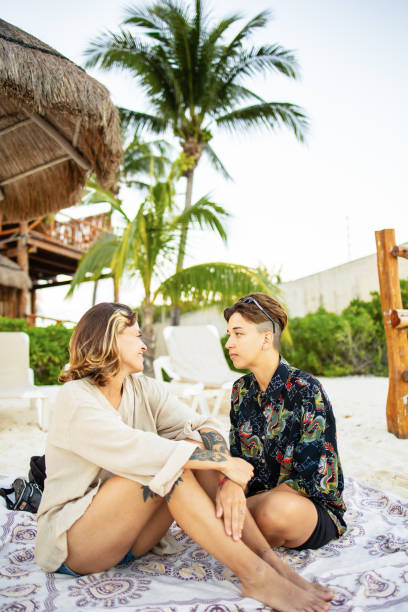 istock Same sex couple enjoying at the beach 1504099477