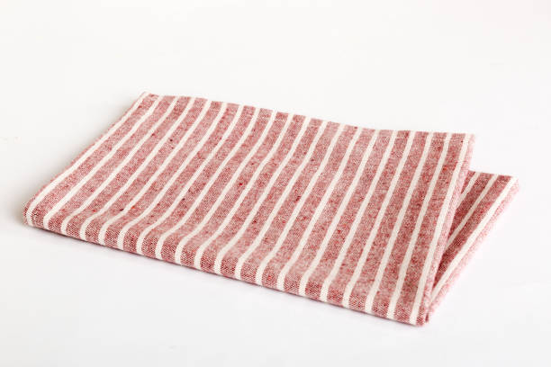 istock top view with red empty kitchen napkin isolated on table background. Folded cloth for mockup with copy space, Flat lay. Minimal style 1504100089
