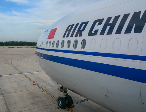 Beijing, China - Aug 14, 2016. A Boeing 777-300ER airplane of Air China docking at Beijing Capital International Airport (PEK).