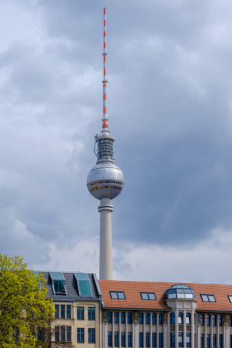 Berlin, Germany - April 19, 2023 : View of the impressive Fernsehturm, the Television Tower in Berlin Germany