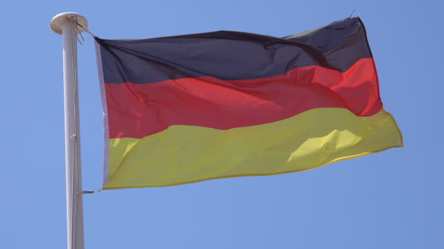 German flag waving in the wind on a flagpole