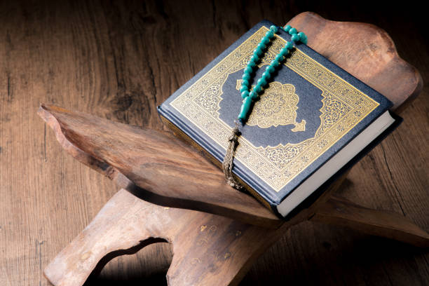 istock The Holy Al Quran with written Arabic calligraphy 1504125328