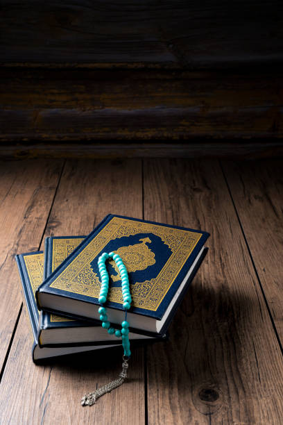 istock The Holy Al Quran with written Arabic calligraphy 1504125330